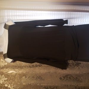 Black long sleeve mini dress w bedazzled shoulder and sleeve cut outs. Open back